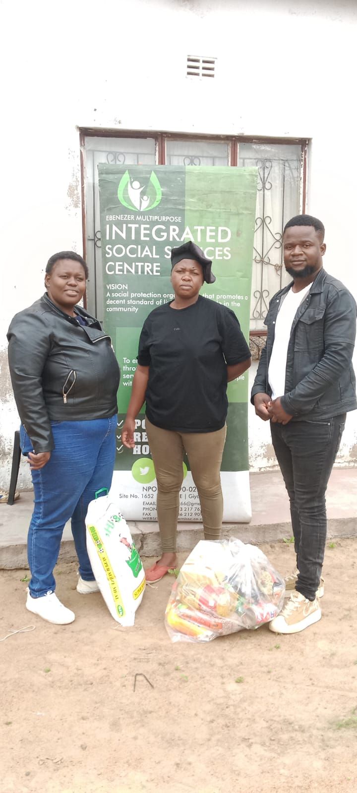 EMISSC food parcel handover to a community member